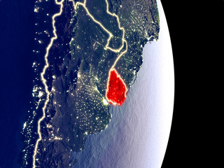 Satellite view of Uruguay at night with visible bright city lights. Extremely fine detail of the plastic planet surface.