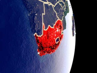 Satellite view of South Africa at night with visible bright city lights. Extremely fine detail of the plastic planet surface.