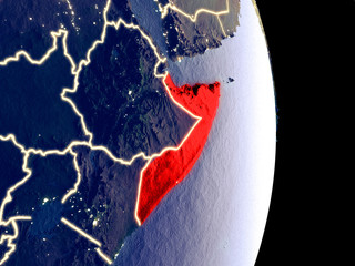 Satellite view of Somalia at night with visible bright city lights. Extremely fine detail of the plastic planet surface.
