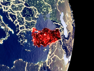 Satellite view of Turkey at night with visible bright city lights. Extremely fine detail of the plastic planet surface.