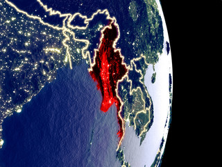 Satellite view of Myanmar at night with visible bright city lights. Extremely fine detail of the plastic planet surface.