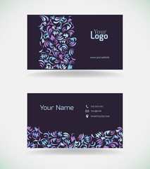 Business card with floral decorations.