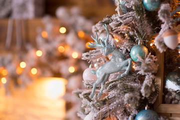 Toys and decoration on a Christmas tree. Bokeh