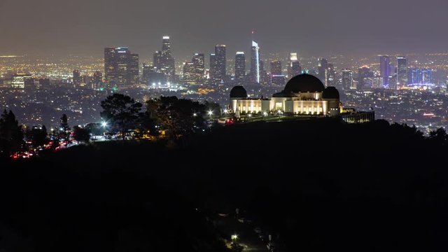 Griffith Observatory and Los Angeles Skyline at Night. A Zoom In Time Lapse from Hollywood Hills.