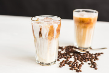 Delicious drink concept - Iced coffee in a glass with ice.