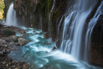 Massive waterfall with blue river