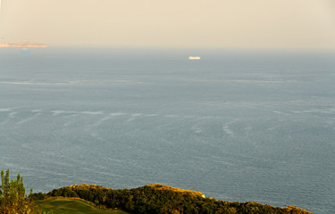 Green Thracian cliffs near blue clear water of Black Sea, rocky path seaview