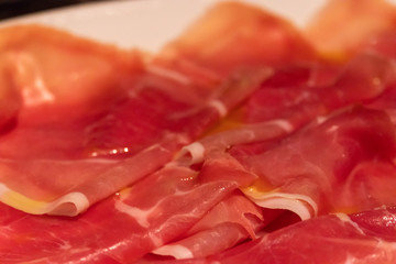 raw ham with olive oil