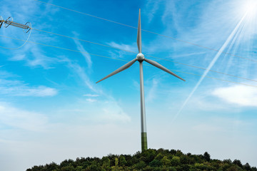 Wind Turbine with a Power Line on Blue Sky