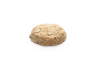 Integral round oatmeal cookie with raisins isolated on white background
