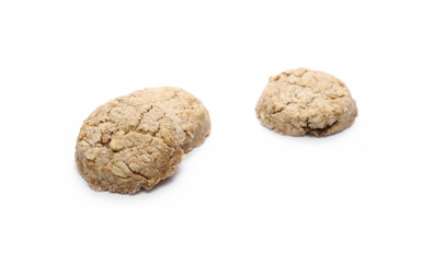 Integral round oatmeal cookies with raisins isolated on white background