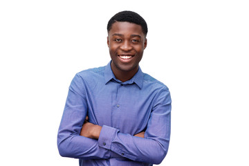 smiling young black man in blue shirt posing with arms crossed against isolated white background