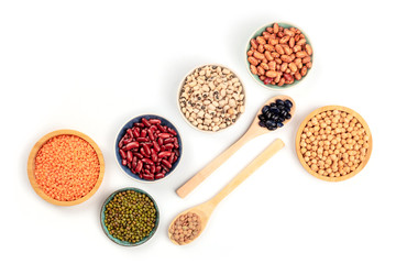 Various types of legumes, shot from the top on a white background with a place for text. Red...