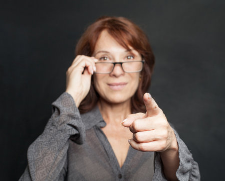 Pointing Hand Of Business Woman On Black