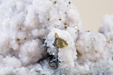 Pyrite on white background, also known as iron pyrite and fools gold