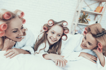 Smiling Women in White Bathrobes Have Fun at Home.