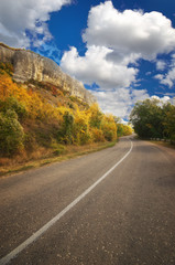 Fototapeta premium Asphalt Road path walkway near autumn mountain.