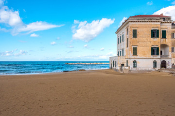 Beach and Building on the southern Italian Mediterranean Coast on a Sunny Day