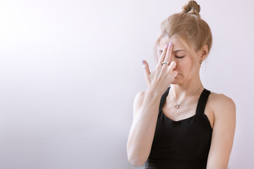 Portrait of adult woman working out against pink wall, doing yoga exercises, relaxing. Copyspace