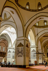 Obraz premium Bursa, Turkey, 30 April 2012: Ottoman Calligraphy, Ulu Mosque or Grand Mosque built in the Seljuk style, it was ordered by the Ottoman Sultan Bayezid I and built between 1396 and 1399.