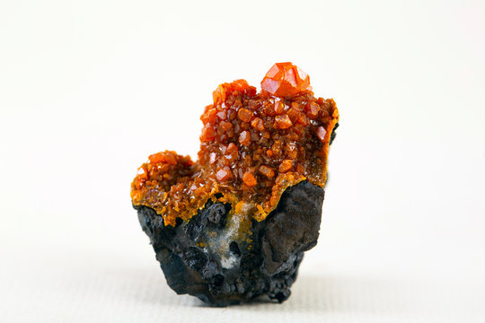 A rich jumble of tabular, reddish-orange wulfenite crystals. Mineral specimen wulfenite crystals orange red stone.
