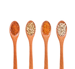 Spices mix on wooden spoons isolated on a white background. Top view