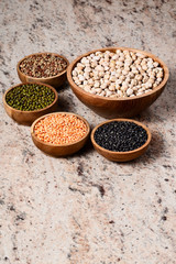 Various assortment of legumes - beans, chickpeas, lentils, black  and green orid dal. Vegetable proteins.