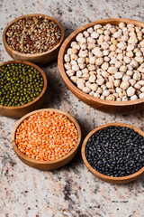 Various assortment of legumes - beans, chickpeas, lentils, black  and green orid dal. Vegetable proteins.