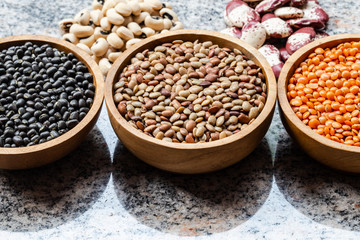Various assortment of indian legumes - lentils, black orid dal, red double beans, white lobia. Vegetable proteins