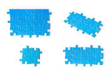 Blue puzzles on white background. Set of blue puzzles. Isolated on white. Business and education