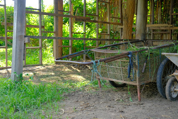 Fototapeta na wymiar garden trolley in old vintage traditonal rural barn