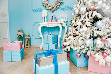 merry christmas and happy new year home decoration with gift boxes and fir tree