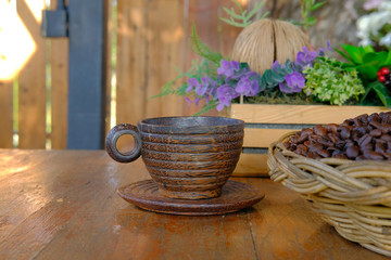 wood cup coffee bean & decorative flower bouquet