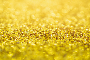 Abstract Gold glitter festive Christmas texture background blur with bokeh light