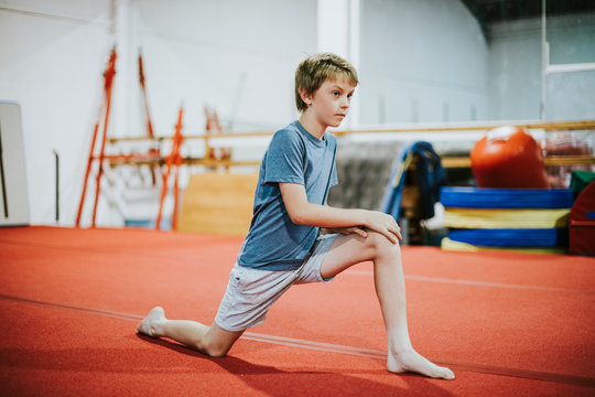 Young gymnast stretching
