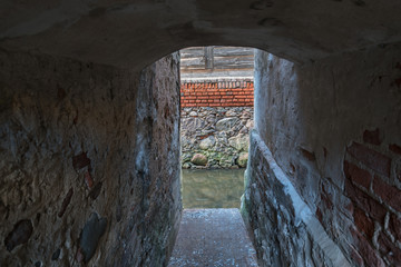 River between houses in old town.