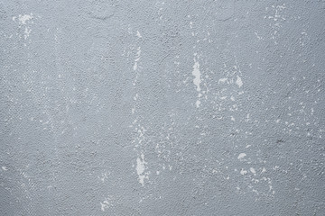 Abstract background from old grey painted on concrete wall with scratched and distress texture. Retro and vintage backdrop.