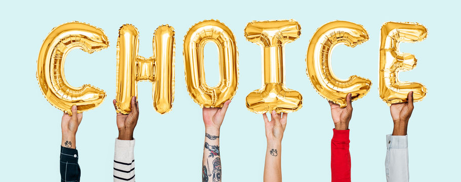 Hands holding choice word in balloon letters