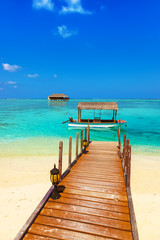 Boat and bungalow on Maldives island