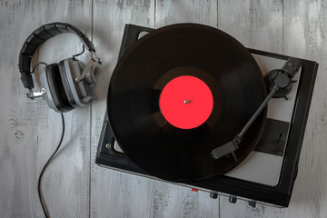 Old record player for vinyl records and headphones © sergeka
