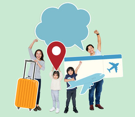 Cheerful family holding travel icons and ticket