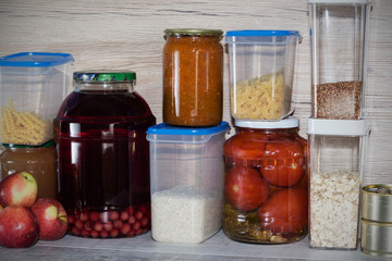 Storage shelves in pantry with homemade canned preserved fruits and vegetables
