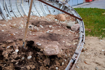wooden boat destroyed a brick wall near