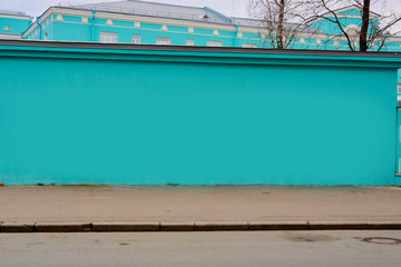 the wall along the turquoise road near