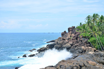 landscape the coast of a wave of the ocean break against stones
