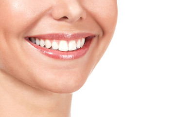 Closeup shot of beautiful female smile, isolated on white background