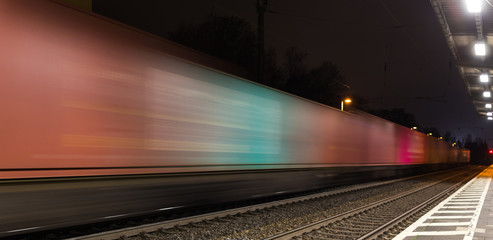 Fototapeta premium container train speed blur at night