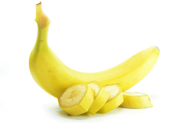Ripe yellow banana with sliced bananas