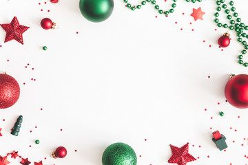 Christmas composition. Christmas red and green decorations on white background. Flat lay, top view,...