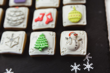 Homemade gingerbread christmas cookies advent calendar on black background